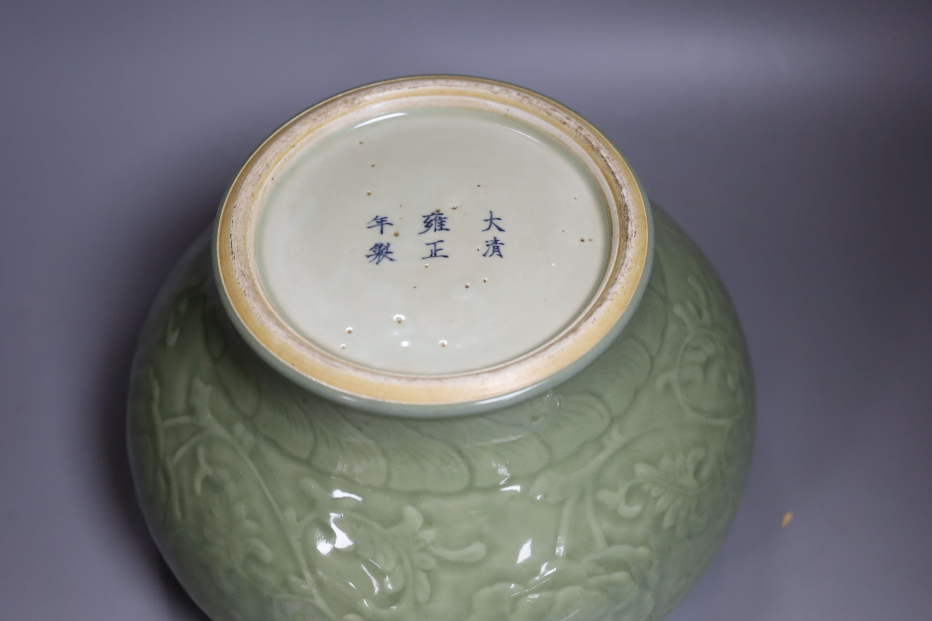 A Chinese celadon glazed bowl - 17.5cm tall